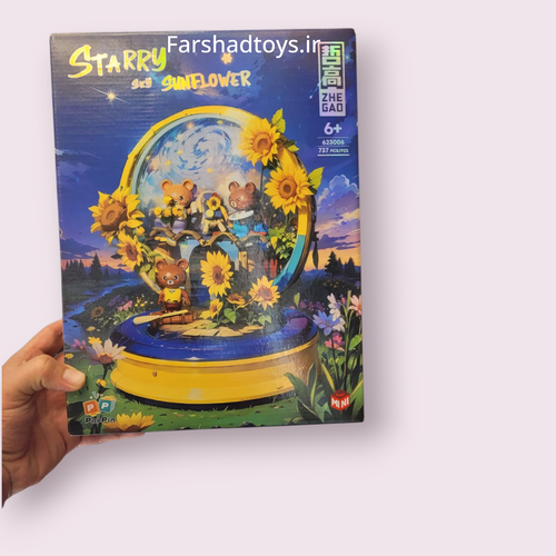 نمای جلوی جعبه لگو استاری سان فلاور 737 قطعه ژه گائو مدل Starry Sunflower کد 623006 در دست در فرشاد تویز
