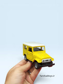 ماشین فلزی تویوتا لندکروزر FJ40 زرد آیتم JS1068 روی دست